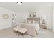 Comfortable primary bedroom with carpeted floors and ensuite bathroom at 111 Silver Moon Ln # 121, Clayton, NC 27527