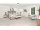 Spacious primary bedroom with plush carpet, soft lighting, and elegant decor at 111 Silver Moon Ln # 121, Clayton, NC 27527