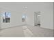 Bright, spacious bedroom with two windows and neutral carpet and paint at 1114 Centerview Drive, Nashville, NC 27856