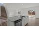Modern kitchen island with a stainless steel dishwasher and wooden flooring at 1114 Centerview Drive, Nashville, NC 27856