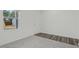 Bright, airy living room featuring a window, hardwood-carpet flooring, and neutral paint at 1114 Centerview Drive, Nashville, NC 27856