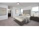 Well-lit main bedroom featuring an ensuite bathroom and neutral decor at 1114 Centerview Drive, Nashville, NC 27856