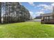 Spacious backyard featuring a green lawn, with a fence bordering the yard at 115 Pecan Harvest Dr, Garner, NC 27529