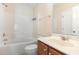 Standard bathroom featuring a bathtub, toilet, vanity, and a mirrored wall at 115 Pecan Harvest Dr, Garner, NC 27529