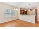 Cozy dining area open to the kitchen, featuring hardwood floors and ample natural light at 115 Pecan Harvest Dr, Garner, NC 27529