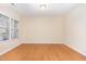 Bright, open room with hardwood floors and a large window providing plenty of natural light at 115 Pecan Harvest Dr, Garner, NC 27529