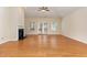 Spacious living room features hardwood floors, a fireplace, and access to the backyard at 115 Pecan Harvest Dr, Garner, NC 27529