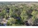Overhead view showcasing the home's wooded surroundings and neighborhood at 11801 Strickland Rd, Raleigh, NC 27613
