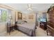 Inviting bedroom featuring a comfortable bed, ceiling fan, and a TV for relaxation and entertainment at 11801 Strickland Rd, Raleigh, NC 27613