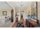 Inviting foyer featuring hardwood floors, elegant decor, and seamless transition to living spaces at 11801 Strickland Rd, Raleigh, NC 27613