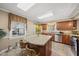 Bright kitchen with granite counters, stainless steel appliances, and a center island, creating an inviting and usable space at 11801 Strickland Rd, Raleigh, NC 27613