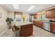 Bright kitchen with granite counters, stainless steel appliances, and a center island, perfect for cooking at 11801 Strickland Rd, Raleigh, NC 27613