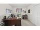 Bright office with a large wooden desk, neutral walls, and a window that offers a relaxing view of the outdoors at 11801 Strickland Rd, Raleigh, NC 27613