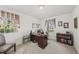 Functional office with a desk, chair, and bright windows at 11801 Strickland Rd, Raleigh, NC 27613