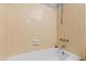 Clean and functional bathroom showcasing a bathtub with shower and tiled walls at 1248 Jamestown Ct, Cary, NC 27511