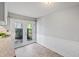Cozy dining area with wainscoting and sliding glass doors leading to the outside at 1248 Jamestown Ct, Cary, NC 27511