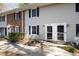 Inviting townhouse exteriors with well-maintained yards and brick and vinyl siding at 1248 Jamestown Ct, Cary, NC 27511