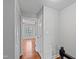 Hallway leading to bedroom with closet, hardwood floors, and fresh paint at 1248 Jamestown Ct, Cary, NC 27511