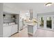 Charming kitchen with granite counters and stainless steel appliances and outdoor access at 1248 Jamestown Ct, Cary, NC 27511