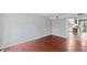 Open living room with hardwood floors that leads into the kitchen at 1248 Jamestown Ct, Cary, NC 27511