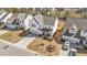 Charming suburban home featuring mature landscaping, a cozy front porch, and attached two-car garage at 1408 Weavers Trace Dr, Zebulon, NC 27597