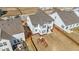 This home's backyard features a patio, seating, barbeque, playground and privacy fence at 1408 Weavers Trace Dr, Zebulon, NC 27597