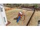 This spacious backyard features a playground, a privacy fence, and a well-maintained lawn at 1408 Weavers Trace Dr, Zebulon, NC 27597