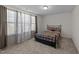 This cozy bedroom features a double bed and large windows with decorative curtains at 1408 Weavers Trace Dr, Zebulon, NC 27597