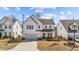 Beautiful two-story home featuring a covered porch, a two-car garage, and an appealing exterior at 1408 Weavers Trace Dr, Zebulon, NC 27597