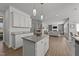 Open concept kitchen and living room with an island and modern appliances at 1408 Weavers Trace Dr, Zebulon, NC 27597