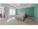 Tranquil primary bedroom with tray ceilings, large windows and carpet floors at 1408 Weavers Trace Dr, Zebulon, NC 27597
