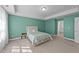 Serene bedroom with an accent wall, carpet floors, a neutral color scheme and ample natural light at 1408 Weavers Trace Dr, Zebulon, NC 27597