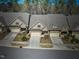 Aerial view of townhouses in neighborhood with manicured yards and mature trees at 147 Glenpark Pl, Cary, NC 27511