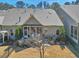 Charming backyard featuring a screened-in patio, fenced-in yard, and well-manicured lawn at 147 Glenpark Pl, Cary, NC 27511