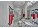 Modern bathroom with a glass enclosed shower, granite counters, neutral paint, and decor at 147 Glenpark Pl, Cary, NC 27511