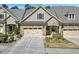 Charming townhouse with a two-car garage and landscaped front yard at 147 Glenpark Pl, Cary, NC 27511