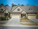 Charming townhouse featuring a 2-car garage and manicured landscaping at 147 Glenpark Pl, Cary, NC 27511