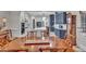 Open-concept kitchen with stainless appliances, white cabinets, and breakfast bar at 147 Glenpark Pl, Cary, NC 27511