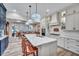 Modern open-concept kitchen with marble countertops, breakfast bar, and stainless appliances at 147 Glenpark Pl, Cary, NC 27511