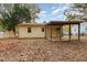 The backyard shows a covered patio and a mature tree line at 164 Torain St, Hillsborough, NC 27278