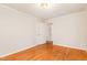 Cozy bedroom features hardwood floors, neutral walls, and natural light at 164 Torain St, Hillsborough, NC 27278