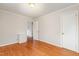 Bedroom with hardwood flooring, an off-white walls, and a white-painted trim at 164 Torain St, Hillsborough, NC 27278