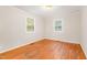 A bedroom featuring natural light, hardwood floors, and neutral-toned walls at 164 Torain St, Hillsborough, NC 27278