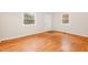 Bedroom featuring hardwood floors, neutral walls, and windows for natural light at 164 Torain St, Hillsborough, NC 27278