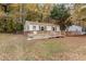 Home exterior with wheelchair ramp, siding and small fenced yard at 164 Torain St, Hillsborough, NC 27278
