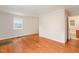 Bright living room boasts hardwood floors, neutral walls and two entry ways at 164 Torain St, Hillsborough, NC 27278