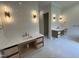 Modern bathroom featuring double vanities, stylish mirrors, and tile floors at 170 Cherry Bark Dr, Youngsville, NC 27596