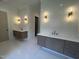 Bathroom featuring dual vanities, modern fixtures, and sleek tile work at 170 Cherry Bark Dr, Youngsville, NC 27596