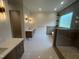 Spacious bathroom featuring dual vanities, modern fixtures, and walk-in shower at 170 Cherry Bark Dr, Youngsville, NC 27596