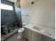 Modern bathroom featuring a tiled shower, toilet, and a vanity with a white countertop at 170 Cherry Bark Dr, Youngsville, NC 27596